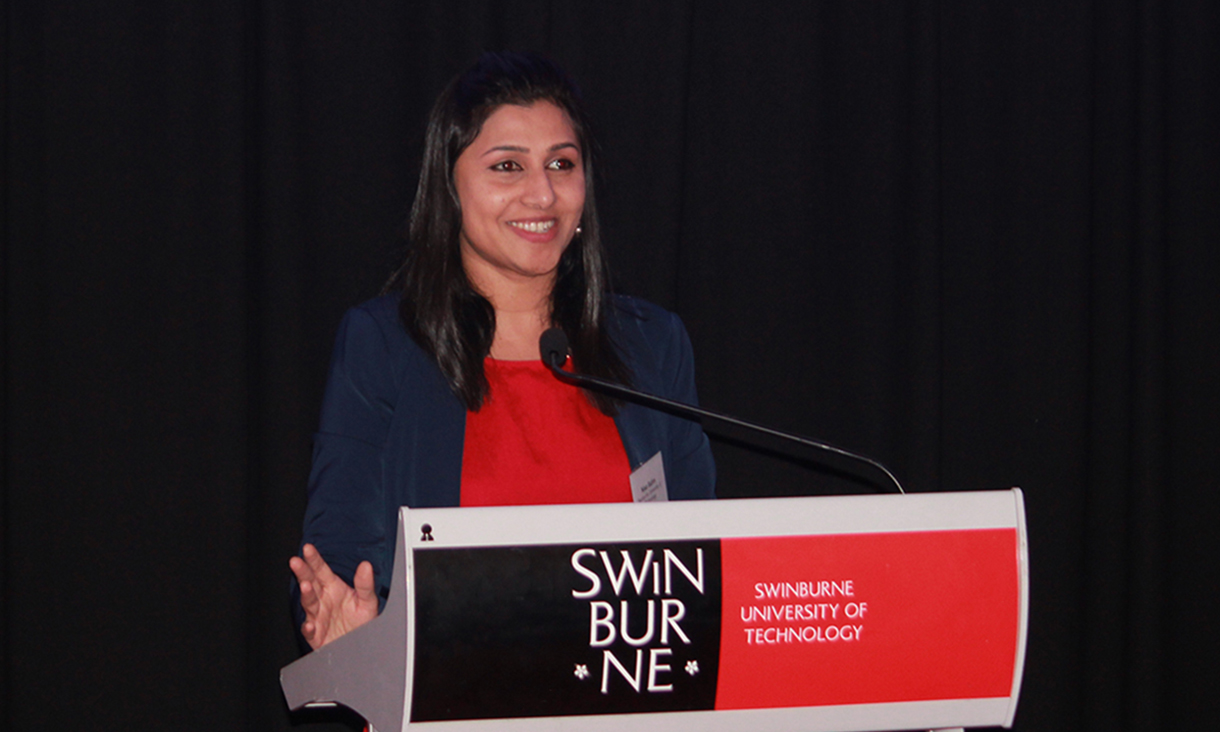 Dr Nisa Salim at lectern